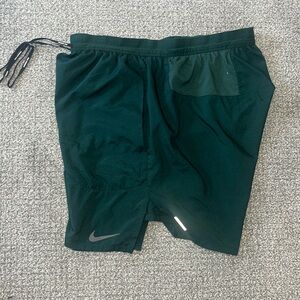 Green Nike running shorts